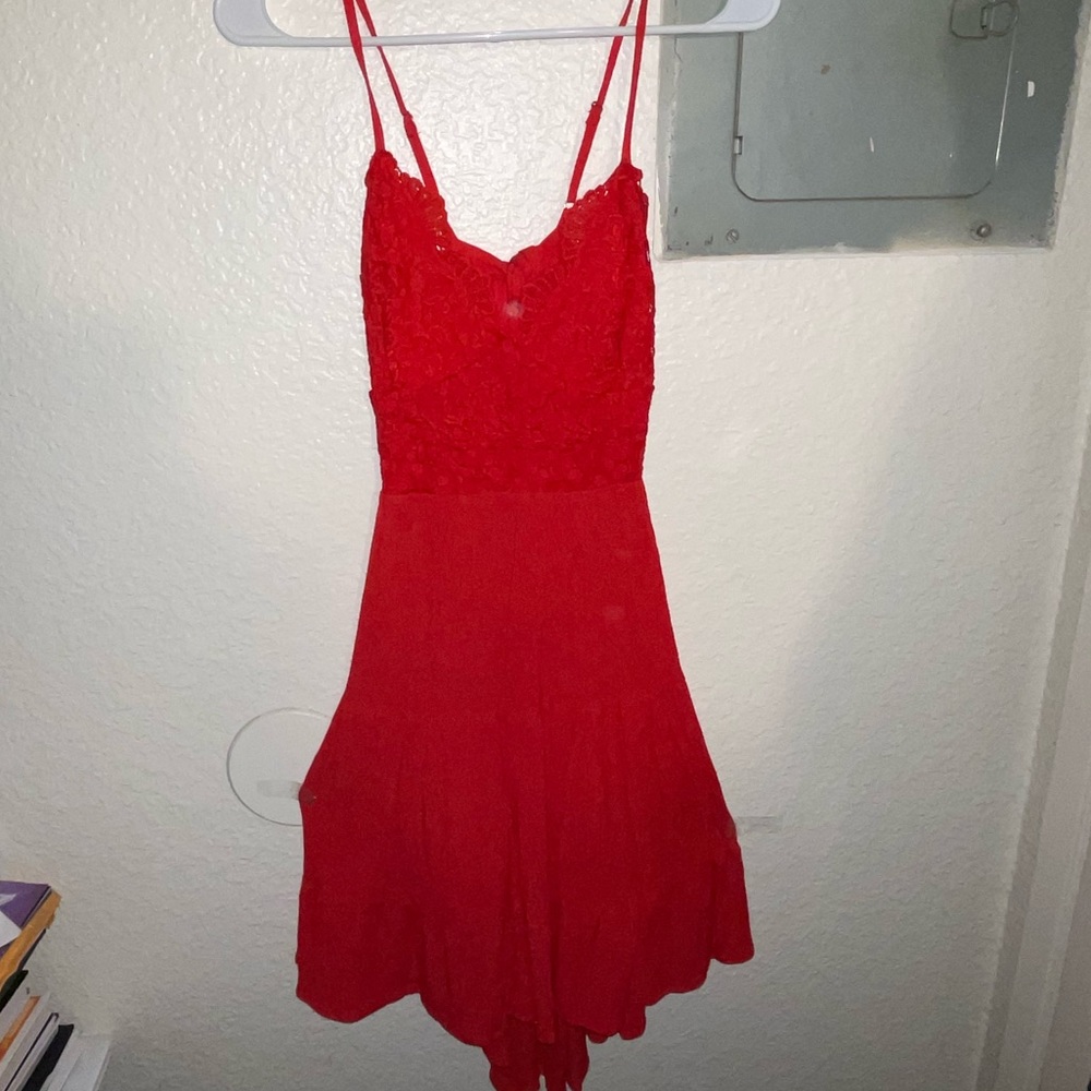 Spaghetti strapped and adjustable cute red dress! With a tie in the back!